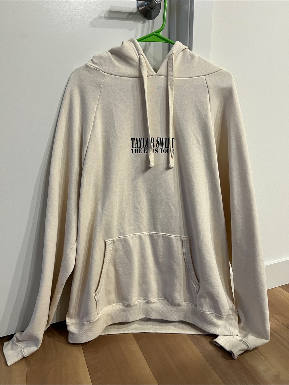 Taylor Swift Cream Pullover Hoodie with Black Chest Logo